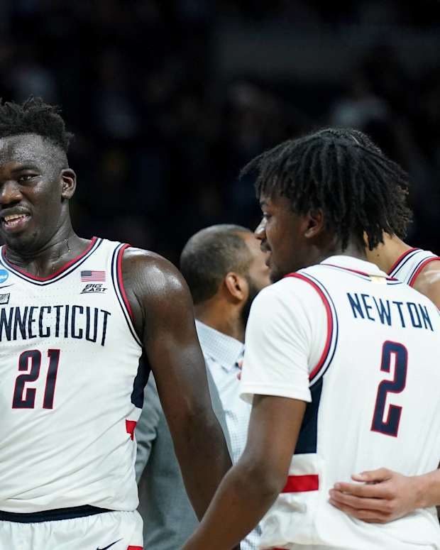 The UConn bench celebrates at a timeout during a game vs. Iona.